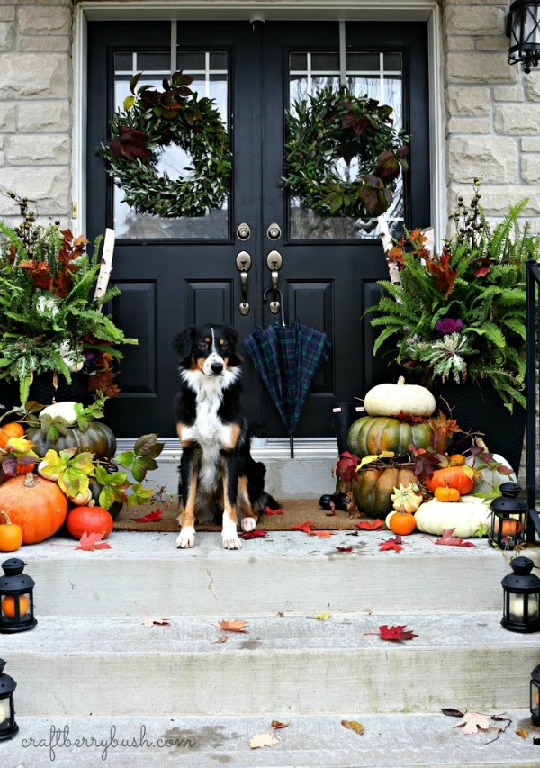 Gourds and little pumpkins inside lanterns are perfect for all those front porch steps! 